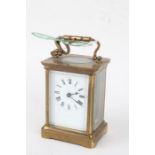 French brass cased carriage clock, the enamel dial with Roman numerals, 14cm high