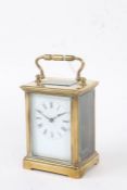 20th Century brass cased carriage clock, the enamel dial with black roman numerals, platform