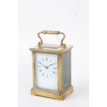 20th Century brass cased carriage clock, the enamel dial with black roman numerals, platform