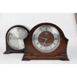 Two Smiths Enfield mantle clocks, the first having a bakelite arch shaped case with silvered dial,