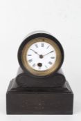 Edwardian slate mantel clock, the white enamel dial with Roman numerals, the case with carved