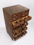 Small wooden chest of 20 drawers containing wrist and pocket watch glasses, various sizes (qty)