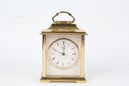 Brass carriage clock by Rapport, the white dial with Roman numerals, 14.5cm high