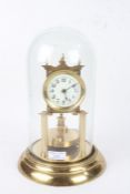 Anniversary clock, the white dial with Arabic numerals, housed under a glass dome, AF, 30cm high