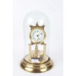 Anniversary clock, the white dial with Arabic numerals, housed under a glass dome, AF, 30cm high
