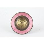 Puce enamel decorated boudoir clock, the circular case with puce enamel bezel, the engine turned