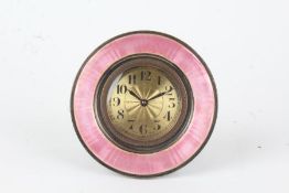 Puce enamel decorated boudoir clock, the circular case with puce enamel bezel, the engine turned