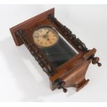Edwardian mahogany wall clock, the cream dial with Arabic numerals, the glazed door flanked by