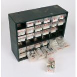 Workshop bank of 29 drawers, containing watch movements, dials, crowns, parts etc. to include a