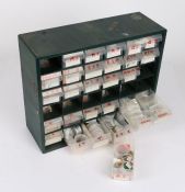 Workshop bank of 29 drawers, containing watch movements, dials, crowns, parts etc. to include a