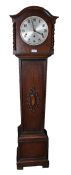 Oak cased grandmother clock, the arched hood with barley twist pilasters, the silvered dial with
