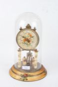 Anniversary clock, the foliate decorated dial with Arabic numerals, housed under a glass dome with