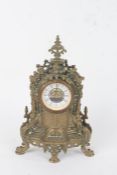 20th Century cast brass mantel clock, in the French style, the white dial with black Roman numerals,