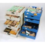Plastic workshop bank of six drawers containing quartz watch movements, pliers etc. Similar ban k of