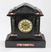 Edwardian slate and marble mantel clock, with metal mask and scroll decorated pediment and