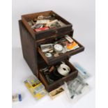 Small chest of five drawers containing wrist and pocket spare parts, Tissot rally style strap