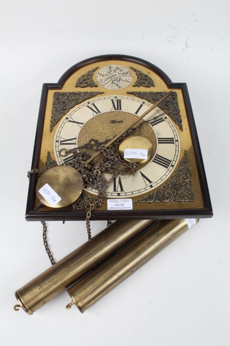 Brass Wall clock made by Hermle with Roman numerals, mask and acanthus leaf spandrels