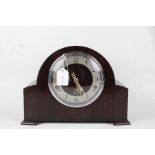 Enfield Clock Co mantel clock, with domed mahogany case, the silvered dial with Arabic numerals,