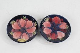 Two Moorcroft pottery Anenome pin dishes, impressed marks to base, and Monkwell 1889-1989, each 11.