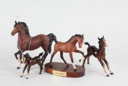 Four Beswick horses, two with matt brown glaze and one titled 'Springtime' (4)