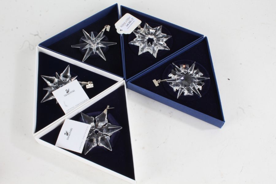 Five Swarovski crystal glass Christmas ornaments, each in the form of an icicle, dated 2000, 2001,