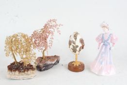 Coalport figure of a lady, Ladies of Fashion Eugenie, together with a decorated faux egg on stand
