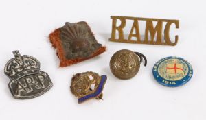 Selection of military badges including, a Royal Artillery collar badge, a George VI Military