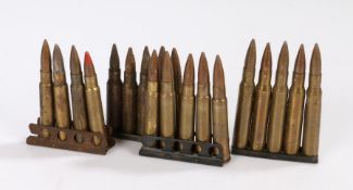 Four clips of small calibre cartridge cases and projectiles, for drill/display purposes, inert, (