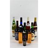 Collection of bottles of alcohol to include Harveys sherry, Cloberg white wine and various others (