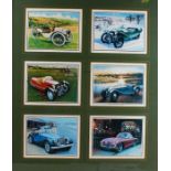 Six coloured prints depicting Morgan cars, framed as one, housed within a wooden and glazed frame,