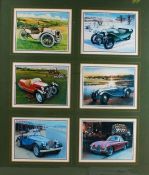 Six coloured prints depicting Morgan cars, framed as one, housed within a wooden and glazed frame,