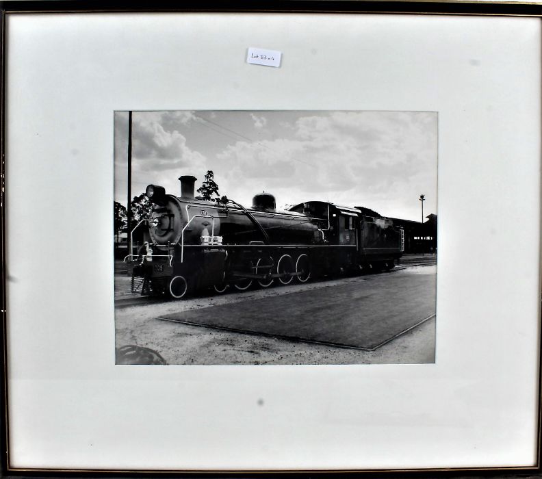 Pair of black and white photographic prints, each depicting trains, together with after Coulson,