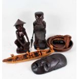 Collection of mostly African carved wooden figured and ornaments, to include figures in a boat, a