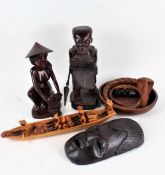 Collection of mostly African carved wooden figured and ornaments, to include figures in a boat, a