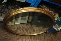 Two gilt framed wall mirrors, one of oval form, 79cm wide, the other of rectangular form, 65cm