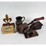 Works of art, to include a Gothic style tankard, two flat irons, pierced brass plagues, mounted