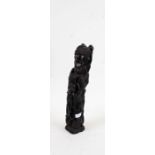 African ebonised figure of characters holding onto each other, 40cm high