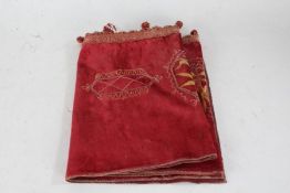 Edwardian mantel cloth, the red ground with gild embroidery and tasselled front, 198cm wide, 29cm