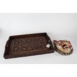 Middle Eastern hardwood tray, of rectangular form with pierced carrying handles and carved foliate