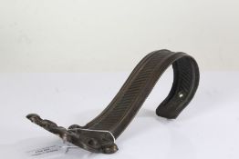 19th Century curtain hook-back, with a scroll design, 21cm long