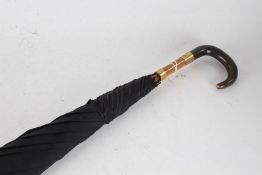 Edwardian umbrella, the curved horn handle with gilt mount initialled JH