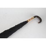 Edwardian umbrella, the curved horn handle with gilt mount initialled JH