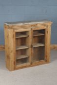 Victorian pine cupboard, the two glazed doors opening to reveal interior shelves, 95cm wide