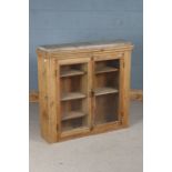 Victorian pine cupboard, the two glazed doors opening to reveal interior shelves, 95cm wide