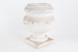 White marble urn, of bulbous form and raised on square base, 26cm high