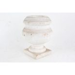 White marble urn, of bulbous form and raised on square base, 26cm high