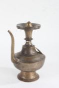 19th Century Indian bronze ewer, the roundel top with screw cap, above a knopped stem, bulbous