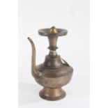 19th Century Indian bronze ewer, the roundel top with screw cap, above a knopped stem, bulbous