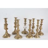 Four various pairs of 19th century brass candlesticks, the tallest 26cm (4)