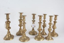 Four various pairs of 19th century brass candlesticks, the tallest 26cm (4)